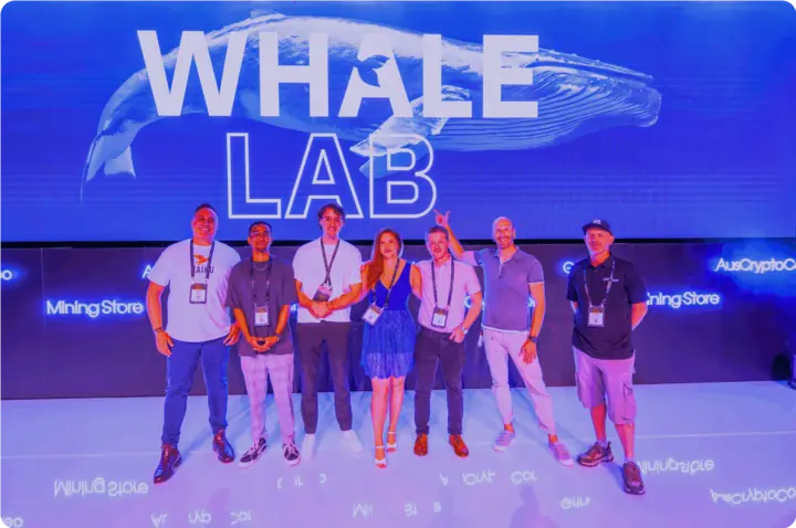 Finalists on the Whale Lab stage in front of a whale backdrop.